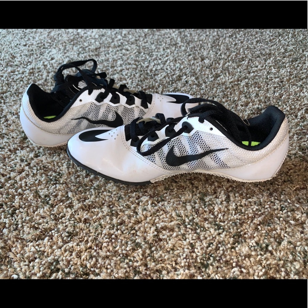 White and black Nike track spikes